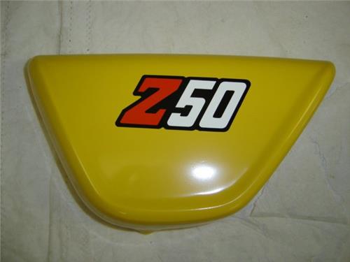 (12) Side Cover Honda Z50 Yellow OEM-hondanuts-Z50-CT70-QA50-SL70-XR75-parts-NOS-OEM-Honda